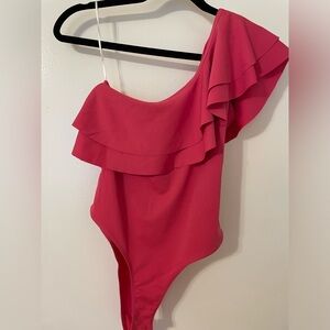 Size small bodysuit with ruffle detail. Never worn!